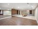 Finished basement featuring tile flooring, brick accent wall, billiards table and a mirrored wall at , Roswell, GA 30075