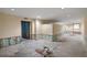 Basement under renovation with exposed insulation, cement floors, and bright recessed lighting at , Roswell, GA 30075