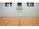 Indoor basketball court with hardwood floors, net, and bright lighting at , Roswell, GA 30075