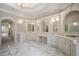 Elegant bathroom featuring marble floors, arched mirrors and custom white vanities at , Roswell, GA 30075