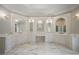 Luxurious bathroom with marble floors, three mirrors and countertop sinks at , Roswell, GA 30075