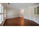 Bright room with hardwood floors, white walls, and shuttered windows providing ample natural light at , Roswell, GA 30075