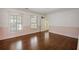 Sunlit bedroom features plantation shutters, wood floors, and connects to an additional room at , Roswell, GA 30075