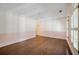 Light-filled bedroom with plantation shutters, hardwood floors, and classic molding at , Roswell, GA 30075
