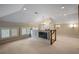 Upper landing area features a decorative chandelier and windows with wooden shutters and TV area at , Roswell, GA 30075