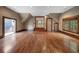 Expansive bonus room with hardwood floors, natural light, and balcony access at , Roswell, GA 30075