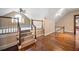 Spacious bonus room with hardwood floors, stair access, and dormer windows, offering a versatile living space at , Roswell, GA 30075