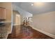 Bonus space with hardwood flooring, kitchen access and stairwell, offering versatile usage possibilities at , Roswell, GA 30075