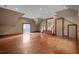 Spacious bonus room with hardwood floors, recessed lighting, and access to a balcony at , Roswell, GA 30075