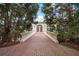 Stunning courtyard featuring brick flooring, manicured landscaping, and a covered entryway at , Roswell, GA 30075