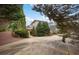 Beautiful home featuring a large driveway, mature landscaping, and a brick path leading to the entrance at , Roswell, GA 30075