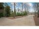 Beautiful two-story brick home with a long driveway, mature landscaping, and a grand entrance at , Roswell, GA 30075