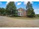 Brick house with manicured lawn and an attached two-story deck at , Roswell, GA 30075
