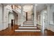 Grand foyer showcases hardwood floors, an elegant staircase, and refined architectural details at , Roswell, GA 30075