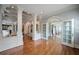 Spacious foyer featuring hardwood floors, elegant columns, and detailed trim work throughout the house at , Roswell, GA 30075