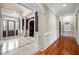Grand foyer with marble floors, elegant chandelier, and decorative molding at , Roswell, GA 30075