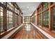 Long hallway with many window features and hardwood flooring at , Roswell, GA 30075