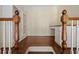 Hallway featuring hardwood floors, staircase, and built in shelves at , Roswell, GA 30075