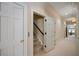 Hallway with carpet floors, access to elevator and view of stairs at , Roswell, GA 30075