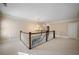 Upstairs hallway with wooden railing and chandelier at , Roswell, GA 30075