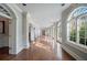 Elegant hallway with hardwood floors, arched doorways, and ample natural light at , Roswell, GA 30075