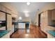 Bright kitchen with granite countertops, stainless steel appliances, and hardwood floors at , Roswell, GA 30075