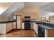 Well-equipped kitchen features bright cabinets, updated appliances, and granite countertops, perfect for cooking at , Roswell, GA 30075