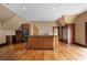 Spacious kitchen island with black countertop and hardwood floors at , Roswell, GA 30075