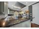 Large kitchen boasting granite countertops, an island, stainless steel appliances, and custom cabinetry at , Roswell, GA 30075
