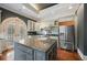 Spacious kitchen features a large island, stainless steel appliances, and custom cabinets at , Roswell, GA 30075