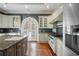 Gourmet kitchen featuring stainless steel appliances, granite countertops, and custom cabinetry at , Roswell, GA 30075
