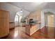 Cozy kitchen featuring light wood cabinets, granite counters, hardwood flooring, and a vaulted ceiling at , Roswell, GA 30075