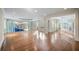 Expansive living room featuring wood floors and seamless transition to an indoor pool at , Roswell, GA 30075