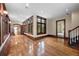 Spacious living room featuring hardwood floors, large windows, and elegant wood trim at , Roswell, GA 30075