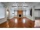 Expansive living room features a brick fireplace, hardwood floors, and detailed trim at , Roswell, GA 30075