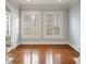 Bright living room with hardwood floors, white trim and plantation shutters at , Roswell, GA 30075