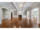 Elegant living room with hardwood floors, fireplace, and custom shelving at , Roswell, GA 30075