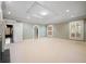 Spacious living room boasts neutral carpet, abundant natural light, and elegant trim at , Roswell, GA 30075