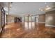 Expansive living room with gleaming hardwood floors, large windows, and elegant trim at , Roswell, GA 30075