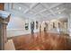 Spacious living room with hardwood floors, coffered ceiling, fireplace and staircase at , Roswell, GA 30075
