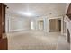 Spacious living room with fireplace, neutral carpet, and multiple doorways at , Roswell, GA 30075