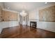Elegant living room with hardwood floors, fireplace, and decorative wall coverings at , Roswell, GA 30075
