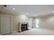 Living room with elegant fireplace and neutral carpet at , Roswell, GA 30075