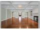 Open living room featuring detailed trim work, hardwood floors and light green walls at , Roswell, GA 30075