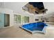 Indoor swimming pool featuring unique mirrored ceiling, tile flooring, and a shower area at , Roswell, GA 30075