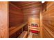Home sauna featuring cedar wood panels, bench seating, and a traditional sauna heater at , Roswell, GA 30075