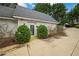 Side Entrance of the house with bushes and a garden at , Roswell, GA 30075