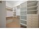 Well-organized walk-in closet with shelving and storage drawers at , Roswell, GA 30075