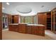 Large walk-in closet with custom wood cabinetry and center island with counterspace at , Roswell, GA 30075