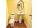 Well-kept half bath featuring a pedestal sink and modern fixtures at 2782 Wynhaven Oaks Way, Lawrenceville, GA 30043